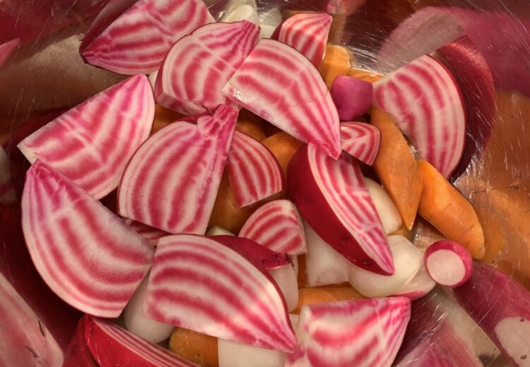 Chiogga beets with pink and white swirled flesh.